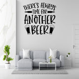 a wall with a large text that says "There's always time for another beer" above a couch with two white pillows.