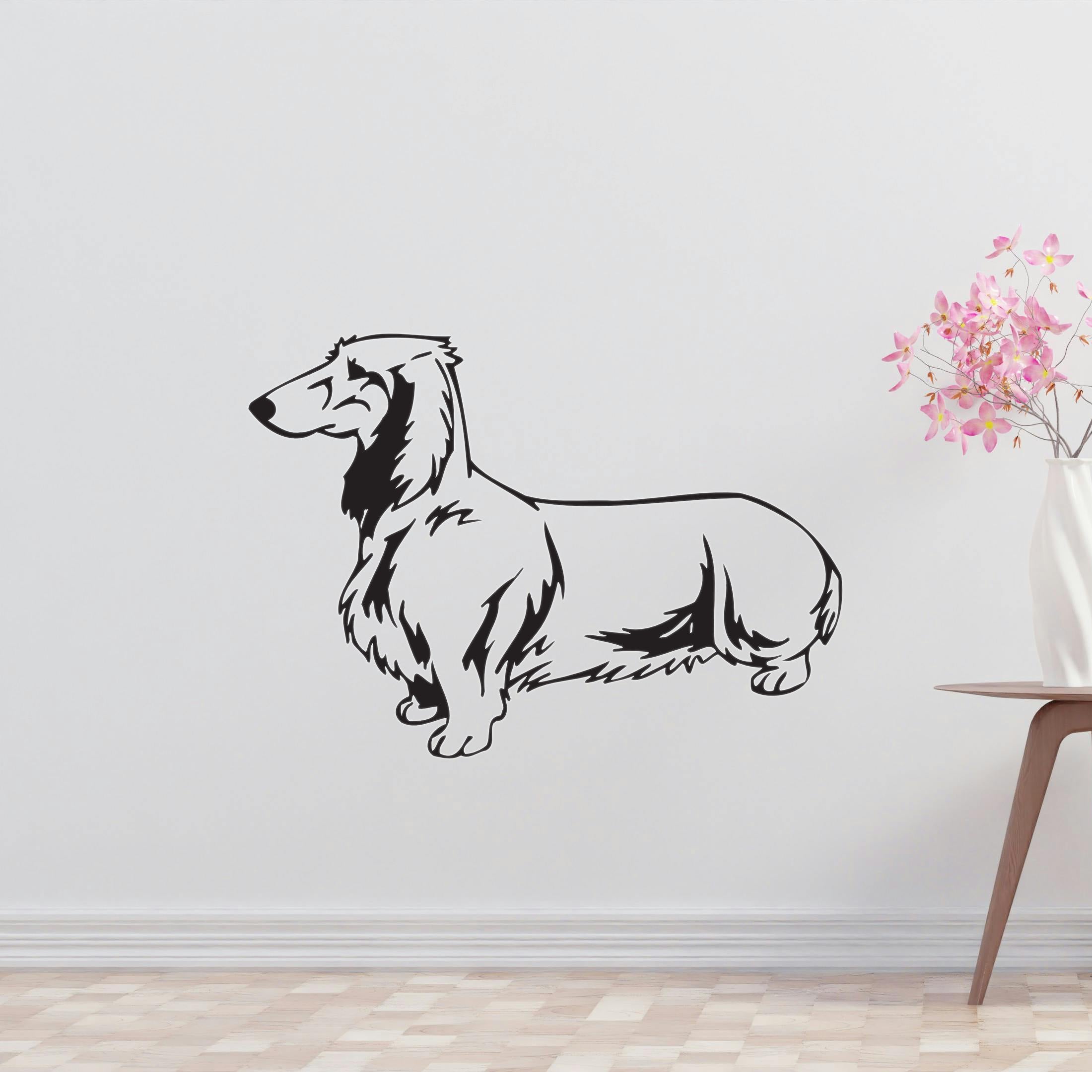 a black and white dog wall decal next to a vase of flowers