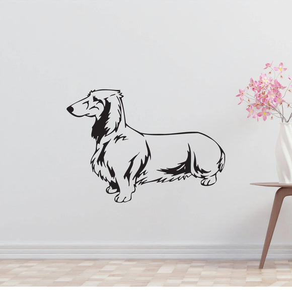 a black and white dog wall decal next to a vase of flowers