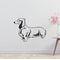 a black and white dog wall decal next to a vase of flowers
