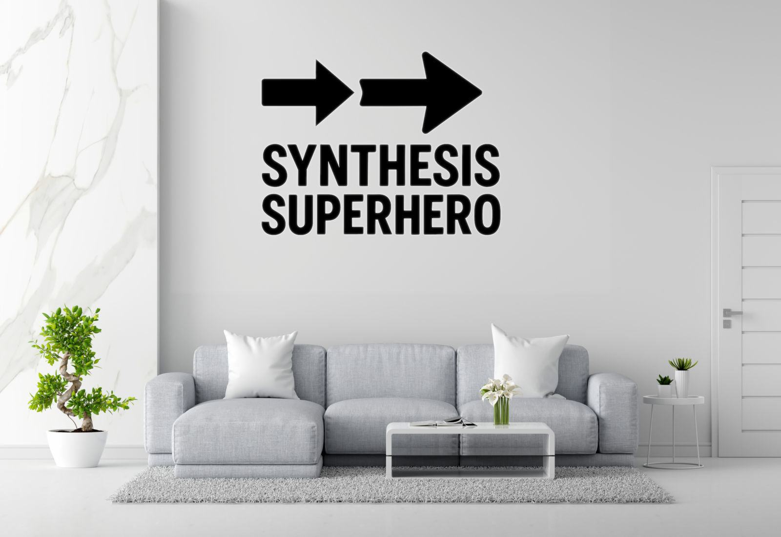 a modern living room with a gray sofa, a coffee table, and a potted plant. Above the sofa, there is a wall decal that says "SYNTHESIS SUPERHERO".
