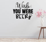 a wall with a humorous text that says "Wish you were beer" in a playful and lighthearted manner.