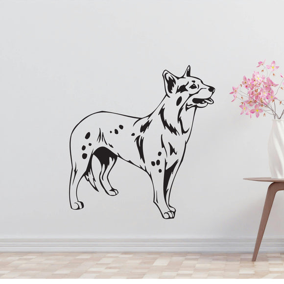 a black and white dog wall decal next to a vase of flowers