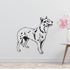 a black and white dog wall decal next to a vase of flowers