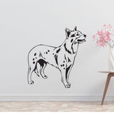 a black and white dog wall decal next to a vase of flowers