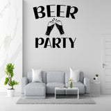 a living room with a gray sofa, a coffee table, and a potted plant. Above the sofa, there is a large wall decal that says "BEER PARTY" in bold letters.