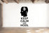 a wall with a black silhouette of a head with a Bitcoin symbol above it, along with the text "KEEP CALM AND HODL" below.