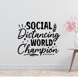 a wall with a large text that says "SOCIAL DISTANCING WORLD CHAMPION" in a stylized font.
