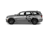 a silver car with a black and white design on it