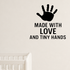 Made With Love And Tiny Hands - Baby Handprint Wall Decal Vinyl Sticker Removable shown as a removable vinyl wall decal in a category-appropriate room
