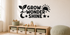 Exact GROW WONDER SHINE black vinyl kids wall decal with sprout, sun, moon, and stars in an alternate nursery view.