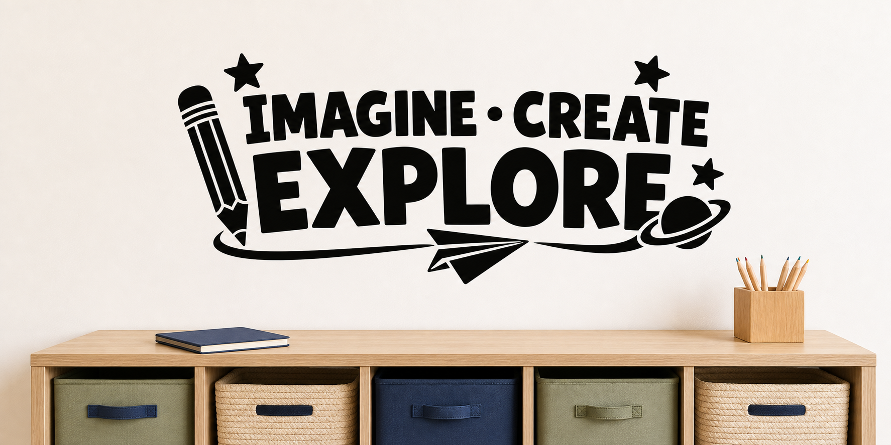 Black Imagine Create Explore kids wall decal with pencil, paper airplane, planet, and stars above a light oak storage console.
