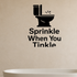 Sprinkle When You Tinkle - Funny Bathroom Wall Decal Vinyl Sticker Removable shown as a removable vinyl wall decal in a category-appropriate room