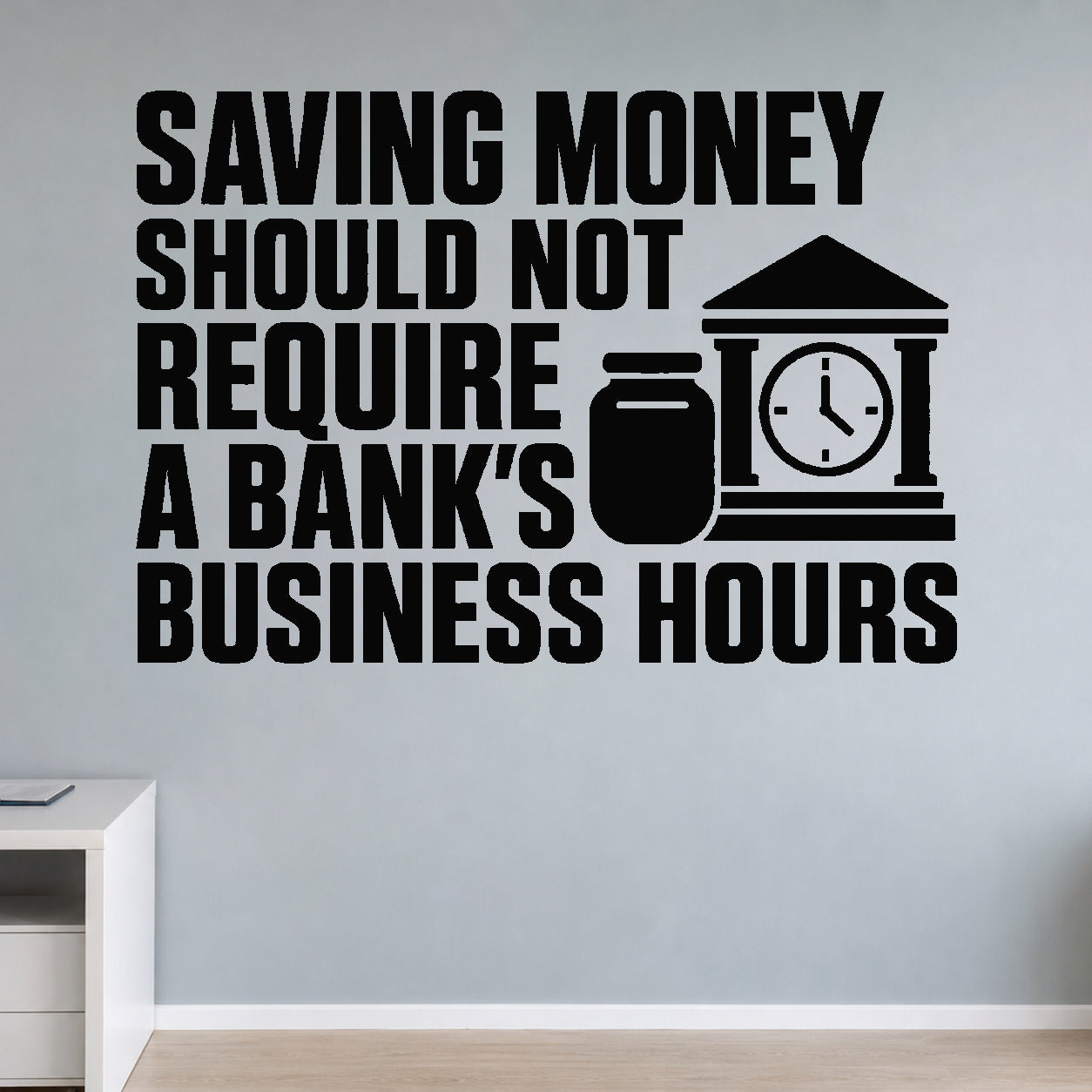 Saving Money Should Not Require a Bank's Business Hours removable vinyl wall decal shown in a styled room.