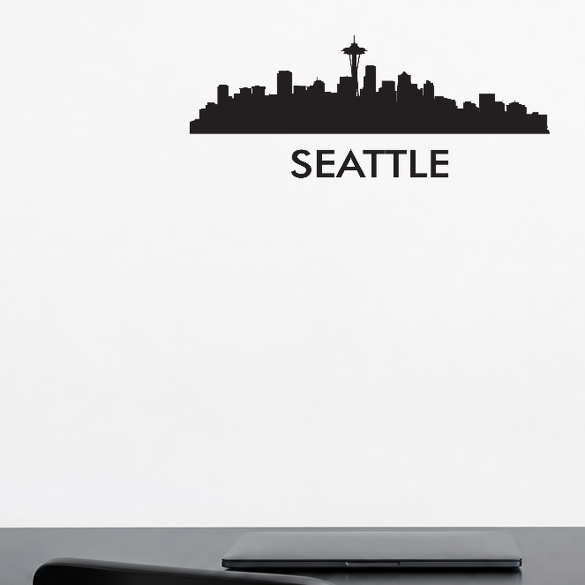 Seattle with text removable vinyl wall decal shown installed in a styled room