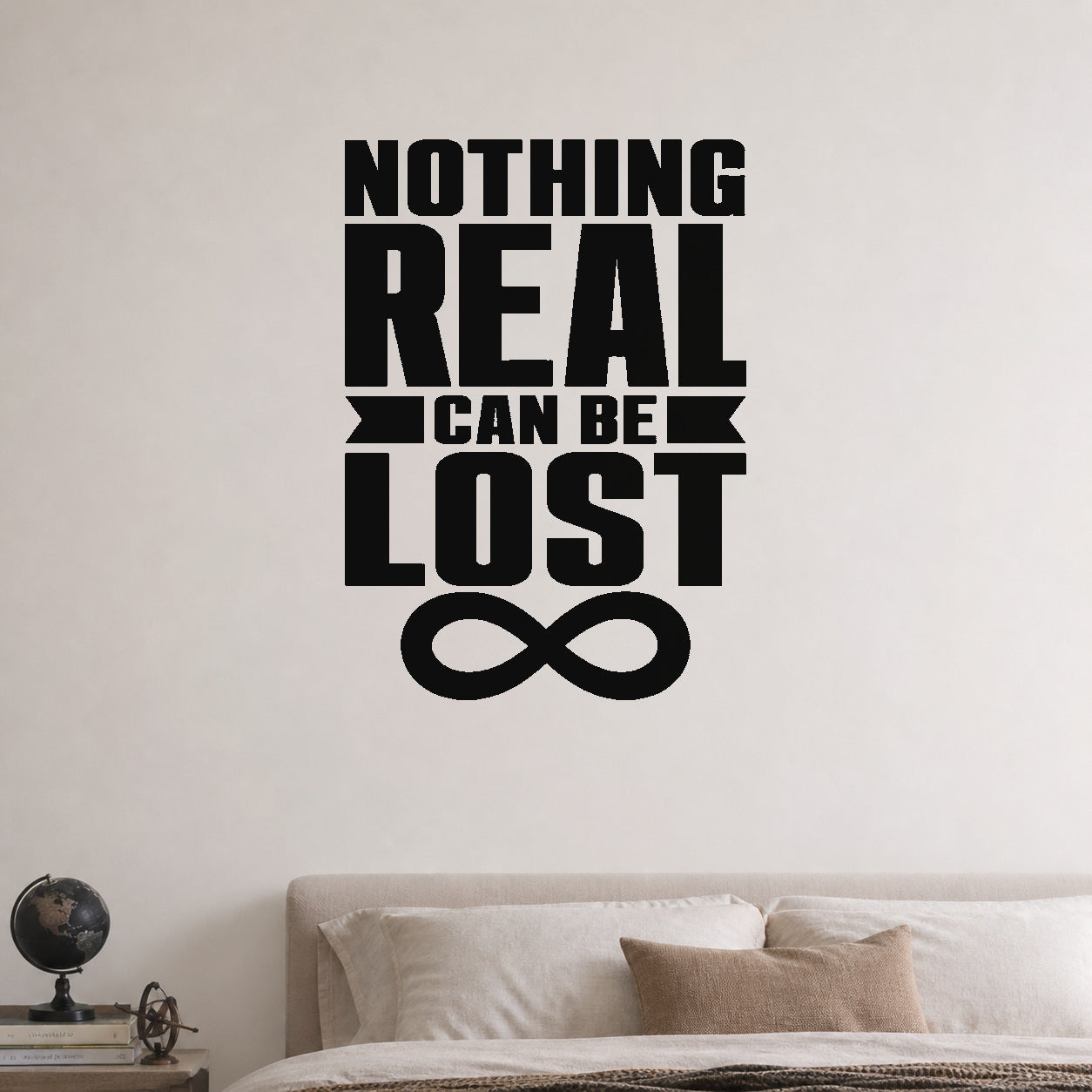Nothing Real Can Be Lost removable vinyl wall decal shown in a styled room.