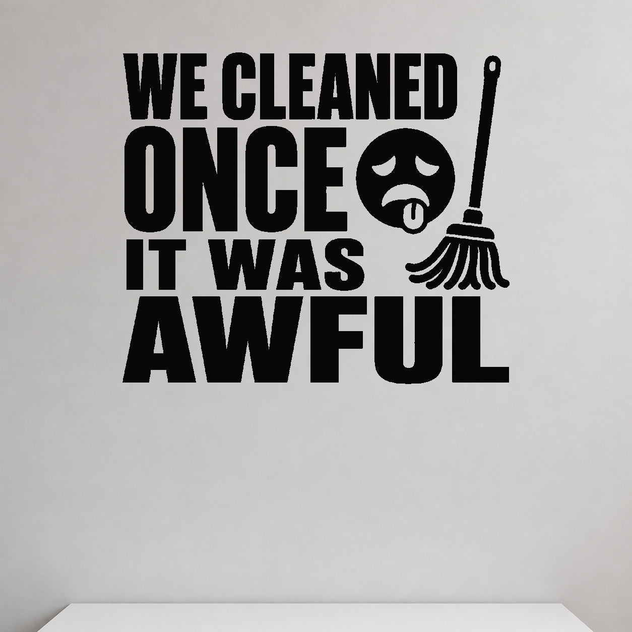 We Cleaned Once It Was Awful removable vinyl wall decal shown in a styled room.
