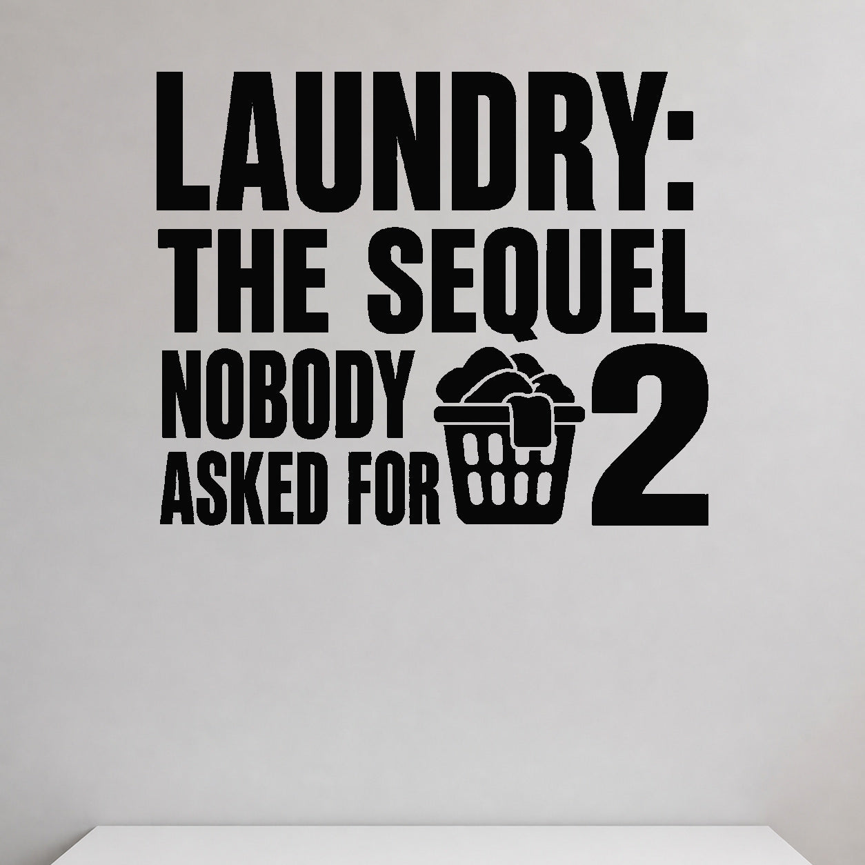 Laundry: the Sequel Nobody Asked for removable vinyl wall decal shown in a styled room.