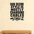 Our Decor Style Is Mostly Charging Cables removable vinyl wall decal shown in a styled room.
