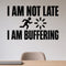 I Am Not Late I Am Buffering removable vinyl wall decal shown in a styled room.