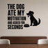The Dog Ate My Motivation and Asked for Seconds removable vinyl wall decal shown in a styled room.