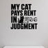 My Cat Pays Rent in Judgment removable vinyl wall decal shown in a styled room.