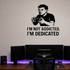 I'm Not Addicted, I'm Dedicated - Funny Gamer Wall Decal Vinyl Sticker Removable shown as a removable vinyl wall decal in a second room setting