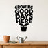 Growing Good Days Here removable vinyl wall decal shown in a garden or greenhouse setting.