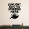 Sunlight Sets the Schedule Here removable vinyl wall decal shown in a garden or greenhouse setting.