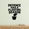 Patience Has a Planting Season removable vinyl wall decal shown in a garden or greenhouse setting.