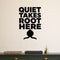 Quiet Takes Root Here removable vinyl wall decal shown in a garden or greenhouse setting.