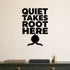 Quiet Takes Root Here removable vinyl wall decal shown in a garden or greenhouse setting.
