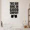This Bar Runs on Good Company removable vinyl wall decal shown in a styled room.