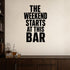 The Weekend Starts at This Bar removable vinyl wall decal shown in a styled room.
