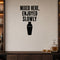 Mixed Here, Enjoyed Slowly removable vinyl wall decal shown in a styled room.