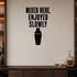 Mixed Here, Enjoyed Slowly removable vinyl wall decal shown in a styled room.
