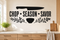 CHOP SEASON SAVOR black kitchen wall decal with chef's knife, herb sprigs, and seasoning bowl above an oak prep counter.