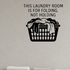 This Laundry Room Is For Folding, Not Holding - Funny Laundry Room Wall Decal Vinyl Sticker Removable shown as a removable vinyl wall decal in a category-appropriate room