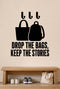 Drop The Bags, Keep The Stories removable vinyl wall decal shown in a mudroom / entryway setting.