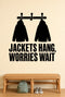 Jackets Hang, Worries Wait removable vinyl wall decal shown in a mudroom / entryway setting.