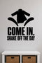 Come In, Shake Off The Day removable vinyl wall decal shown in a mudroom / entryway setting.