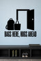 Bags Here, Hugs Ahead removable vinyl wall decal shown in a mudroom / entryway setting.