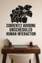 Currently Avoiding Unscheduled Human Interaction black vinyl wall decal shown applied to a smooth interior wall