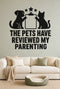 The Pets Have Reviewed My Parenting black vinyl wall decal shown applied to a smooth interior wall