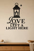 Love Left a Light Here black vinyl wall decal shown applied to a smooth interior wall