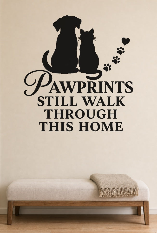 Pawprints Still Walk Through This Home black vinyl wall decal shown applied to a smooth interior wall
