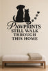 Pawprints Still Walk Through This Home black vinyl wall decal shown applied to a smooth interior wall
