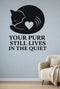 Your Purr Still Lives in the Quiet black vinyl wall decal shown applied to a smooth interior wall