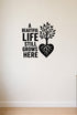 A Beautiful Life Still Grows Here removable vinyl wall decal shown in an alternate room setting