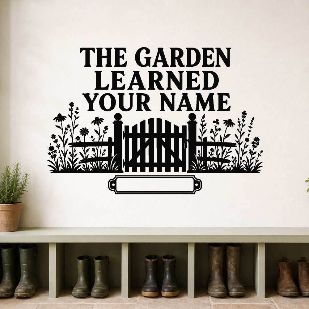 The Garden Learned Your Name large-format removable vinyl wall decal shown on a smooth garden mudroom wall